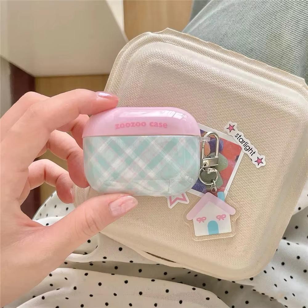 Open view of The Sweet Charm Grid Case, demonstrating the secure internal fit and smooth finish of the quilted plaid AirPods protective shell.