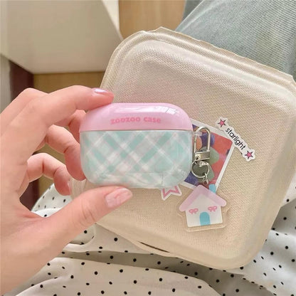 Open view of The Sweet Charm Grid Case, demonstrating the secure internal fit and smooth finish of the quilted plaid AirPods protective shell.