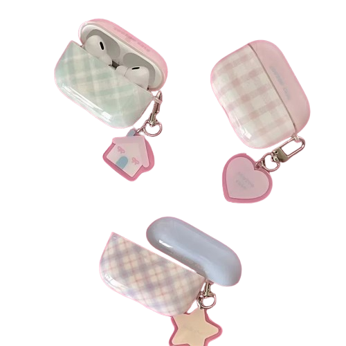 Close-up of The Sweet Charm Grid Case Pink, highlighting the soft padded diamond grid texture and the decorative silver star keychain attachment.