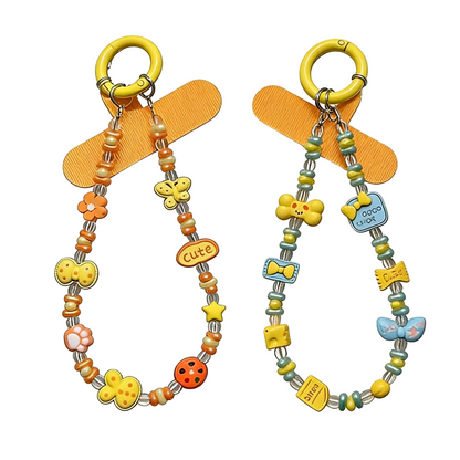 CasePoppi Whimsical Beaded Phone Charm collection, showing both Orange and Blue variations with assorted cartoon animal and motivational word charms.