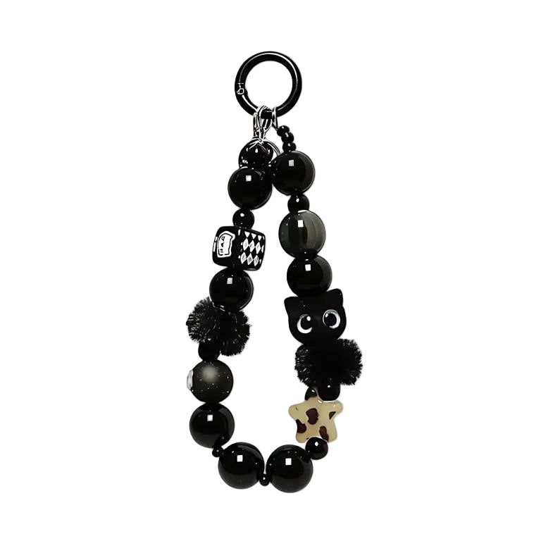 CasePoppi Black Cat Beaded Phone Charm, featuring a black cat charm, black pompoms, houndstooth beads, and multi-shaped glass beads, Y2K aesthetic.