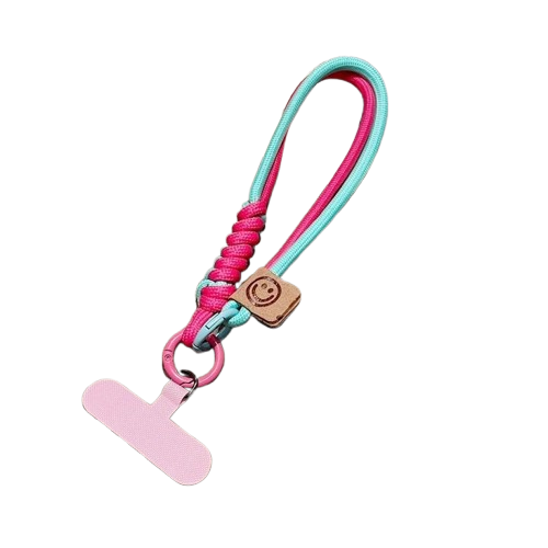 CasePoppi Gorpcore Braided Phone Strap, mint green and soft pink dual-rope design with a tan smiley leather tag, compact hand wristlet.