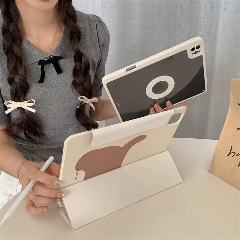 User holding a CasePoppi Puppy iPad Case and stylus, showing the integrated pencil holder slot and cute aesthetic in a lifestyle setting.