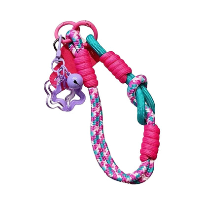 CasePoppi Y2K Braided Phone Strap, fuchsia pink cord with geometric blue-green pattern, fuchsia O-rings and purple flower hook.