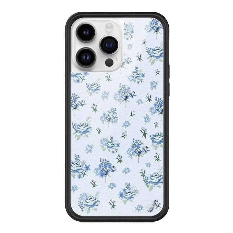 Cute blue rose floral pattern phone case for iPhone 17 Pro, dainty small blue flowers on white cover with protective black bumper.
