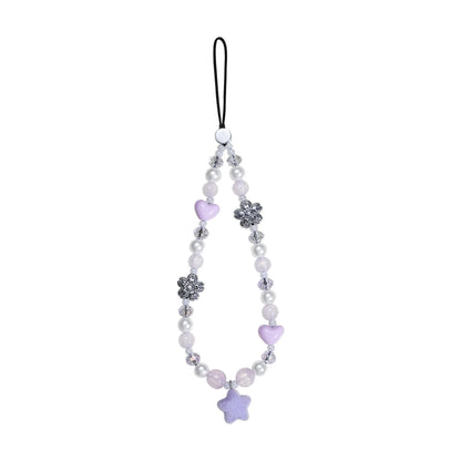 A cute purple and pastel gray beaded phone charm wrist strap featuring star and flower beads, isolated on a white background.