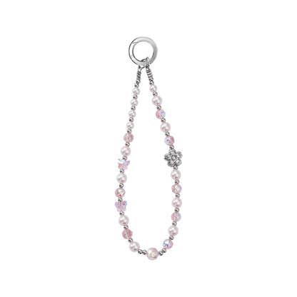 A subtle soft pink crystal and glass beaded phone charm strap with small silver accent beads, on a solid white background.