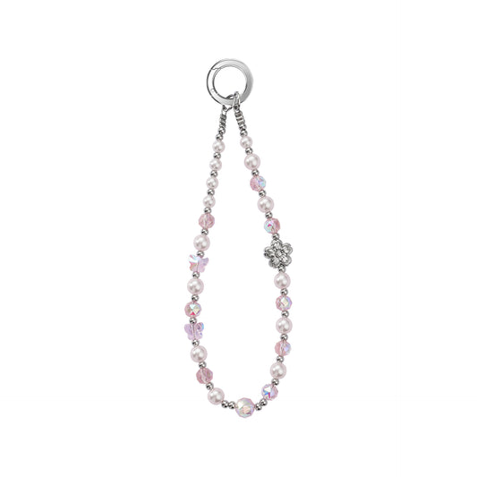 A subtle soft pink crystal and glass beaded phone charm strap with small silver accent beads, on a solid white background.