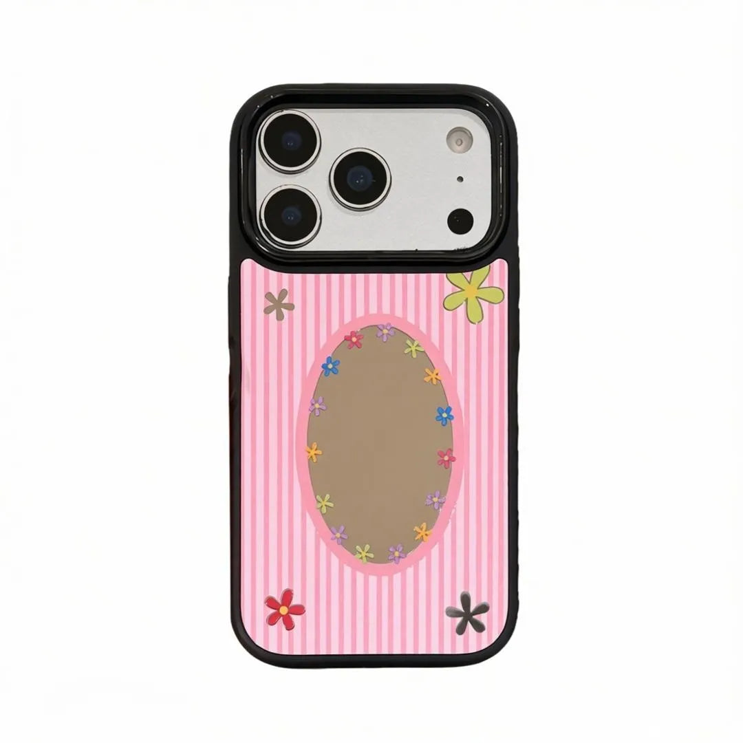 Pink striped phone case with daisy-framed oval mirror
