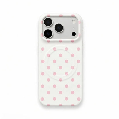 Pink polka dot phone case on white base with magnetic attachment