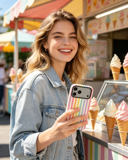 Woman holding rainbow pastel striped phone case outdoors